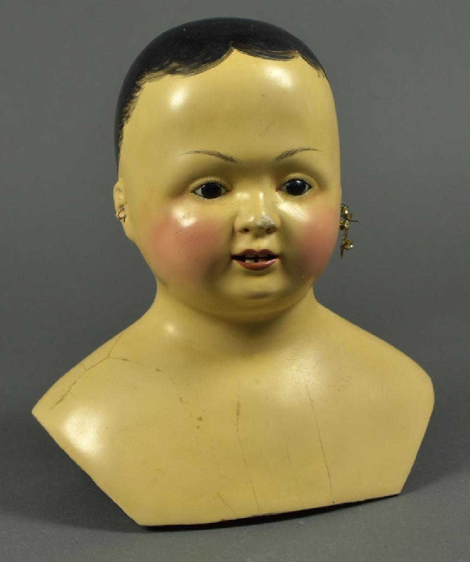Papier Mache French Type Shoulderhead Only: Set in glass eyes, bamboo teeth c. 1840. 8 1/2" H, shoulderplate is 5" W at base. Repairs and repaint, chips.
