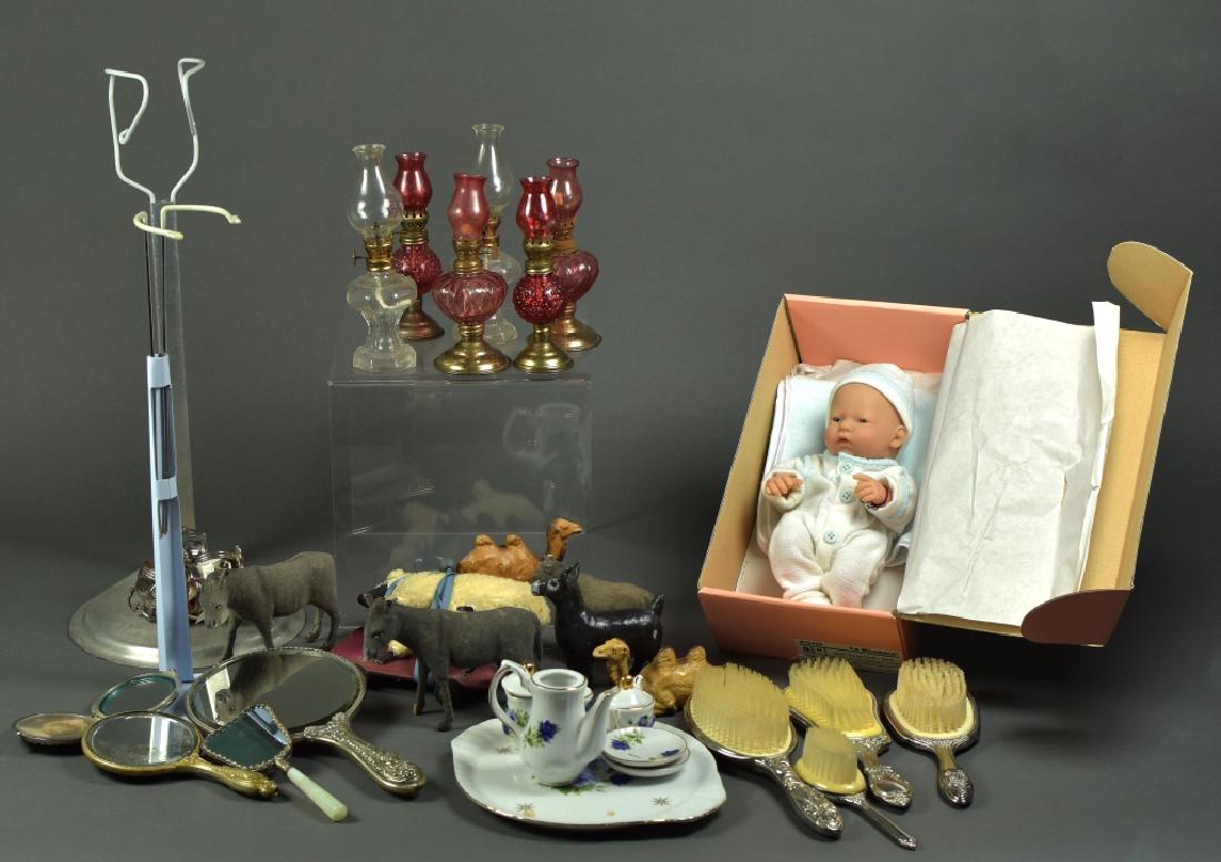 Box Lot of Misc Doll Items: Including: Porcelain child's tea set, 6 Nativity Animals, 4 Silverplate vanity brushes, 2 Silverplate vanity mirrors,1 Silver plate vanity compact, 6 Fairy lamps (miniature oil lamps).Set of 8 Silver