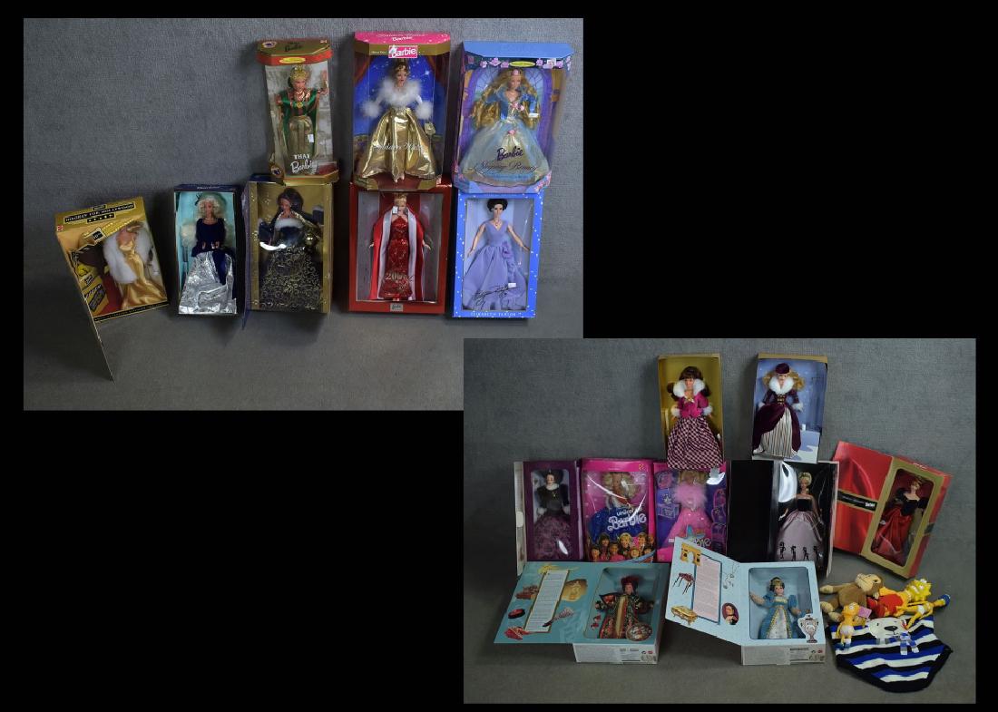 Box of Barbies Including Elizabeth Taylor: Golden Waltz, Unicef and more. Also Bart and Marge Simpson and a dog sweater. 22 items total.