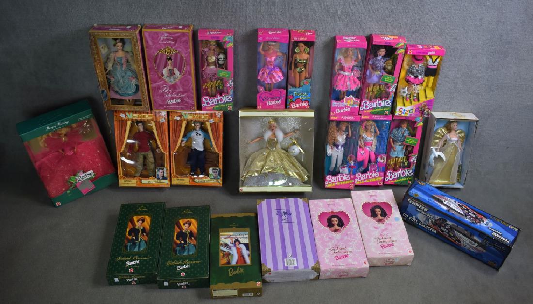 Twenty Barbies: Including Animal Loving Ken & Barbie, Hallmark Special Edition, Yuletide Romance and more. Along with N Sync dolls and Tennaco Automotive Dragster.