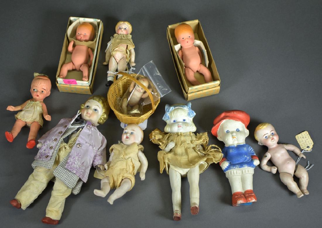 Variety Group of Dolls- Eleven Pieces: 4 1/4" early all bisque child doll with blond hair and black heeled shoes. No damage. 4 1/2" all bisque German boy doll, painted features, chips on back of legs. 5" Japanese immobile, all bisque boy w