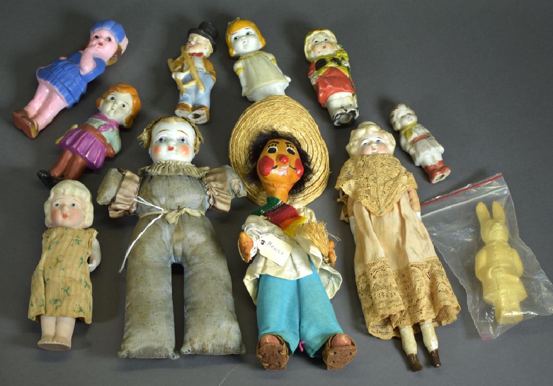 Lot of Variety of Dolls: Japanese Immobials, pincushion doll, Mexico tourist doll, shoulderhead doll, and more.