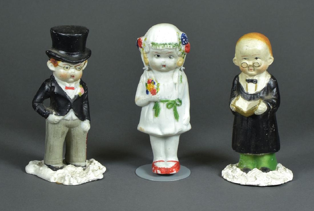 Three Piece Wedding Set: 4 3/4". Pastor, bride, groom. All bisque, Made in Japan. Pastor and groom are set in plaster.