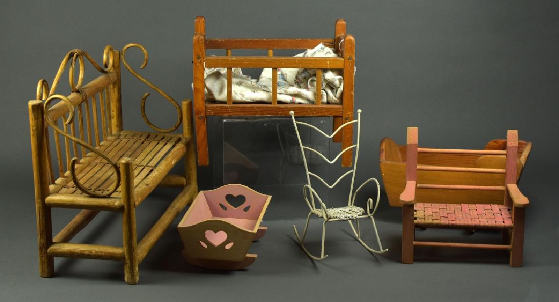 Lot of Doll Furniture: 16"L bamboo bench with bent wood details. 12" wood doll bed, some damage. 13"vintage wood doll cradle, handmade. 8" wood and reed small bench. 7 1/2"L wood cradle with heart detail. 9" metal white roc
