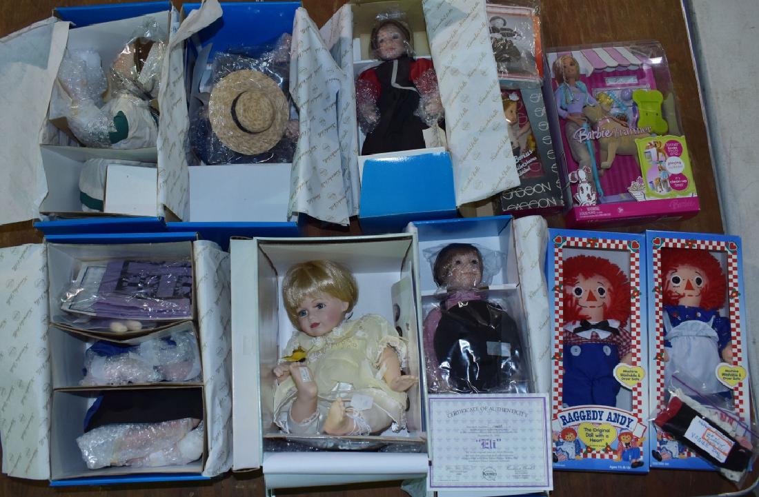 Six Boxed Ashton Drake Dolls and More: Hasbro boxed Raggedy Ann and Andy. Vogue Ginny in box with outfit. Barbie and Tanner.