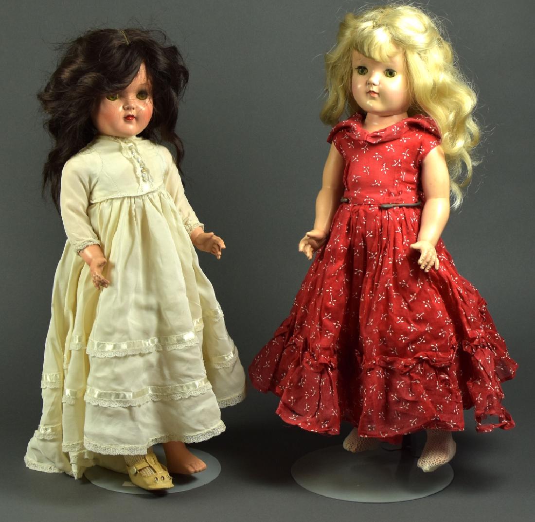 Ideal Toni Dolls P-92 and P-19: P-92. 19". Brunette. Hard plastic. Doll in vintage dress. Missing one shoe and sock. Very good face color. P-19. 19" Hard plastic. Ideal blond Toni doll in red organdy dress.
