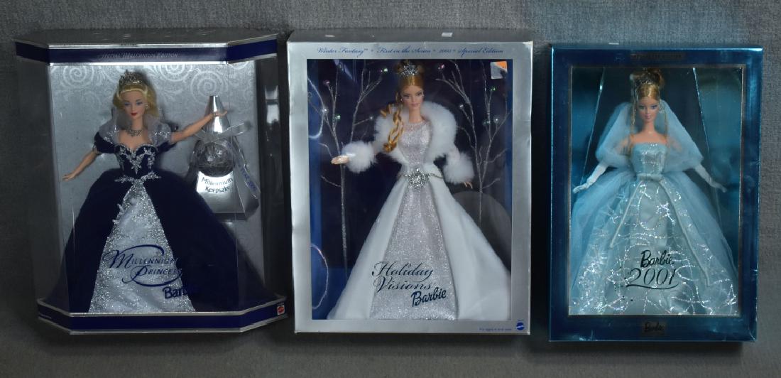 Three Holiday and New Year Barbies: Includes Barbie 2001, 2003 Holiday Visions, and Millenium Princess. Good condition with wear and scuffing to boxes.