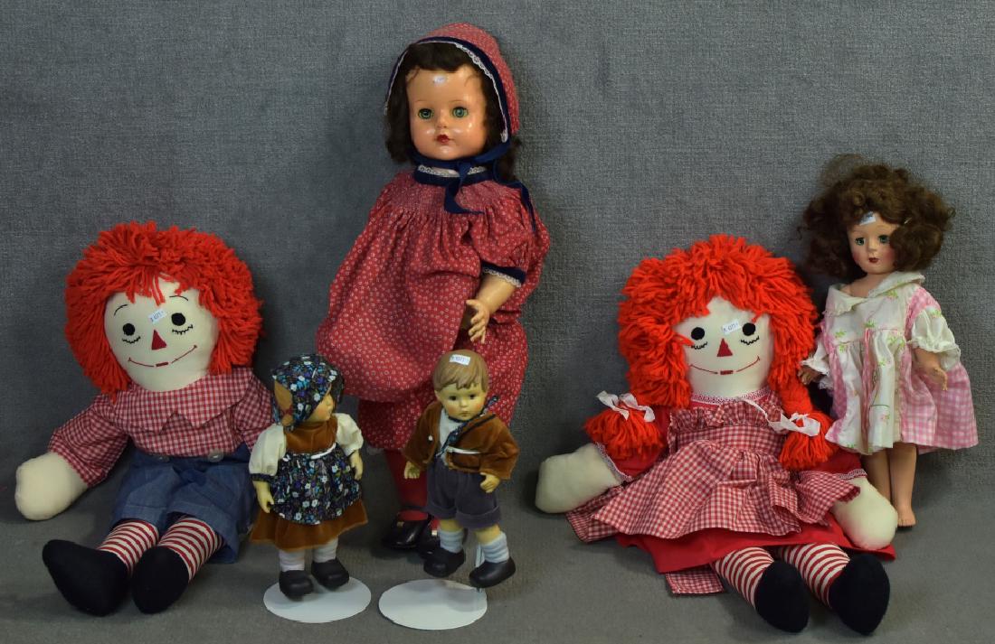 Raggedy Ann & Andy Cloth Dolls and More: Along with an Ideal VP-23. Doll has paint marks on her body and the face is sticky, faded clothes. Two Hummel type bisque dolls ( good condition ) and one unmarked vintage doll ( fair condition ). Rag