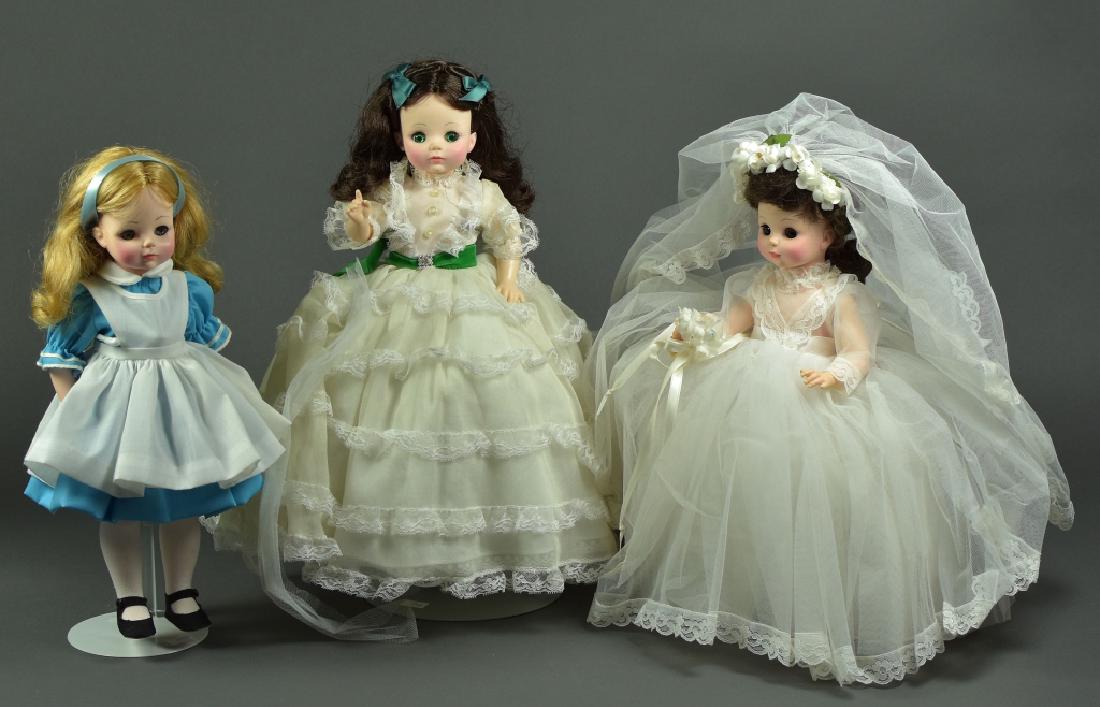 Three Madame Alexander Dolls: In original boxes- Alice 1552, Bride 1570, and Gone With The Wind Scarlett 1590. Dolls have been on display and are not pristine, there is yellowing to Scarlett's dress and wear and tear to the boxes.