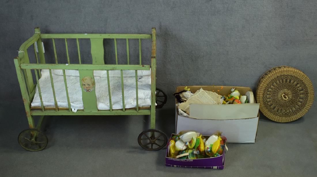 Green Painted Crib and Accessories: Includes East German plastic toys, Ertl deer, etc. Crib shows wear to paint abut overall still sturdy, measures 27" x 15" x 22".