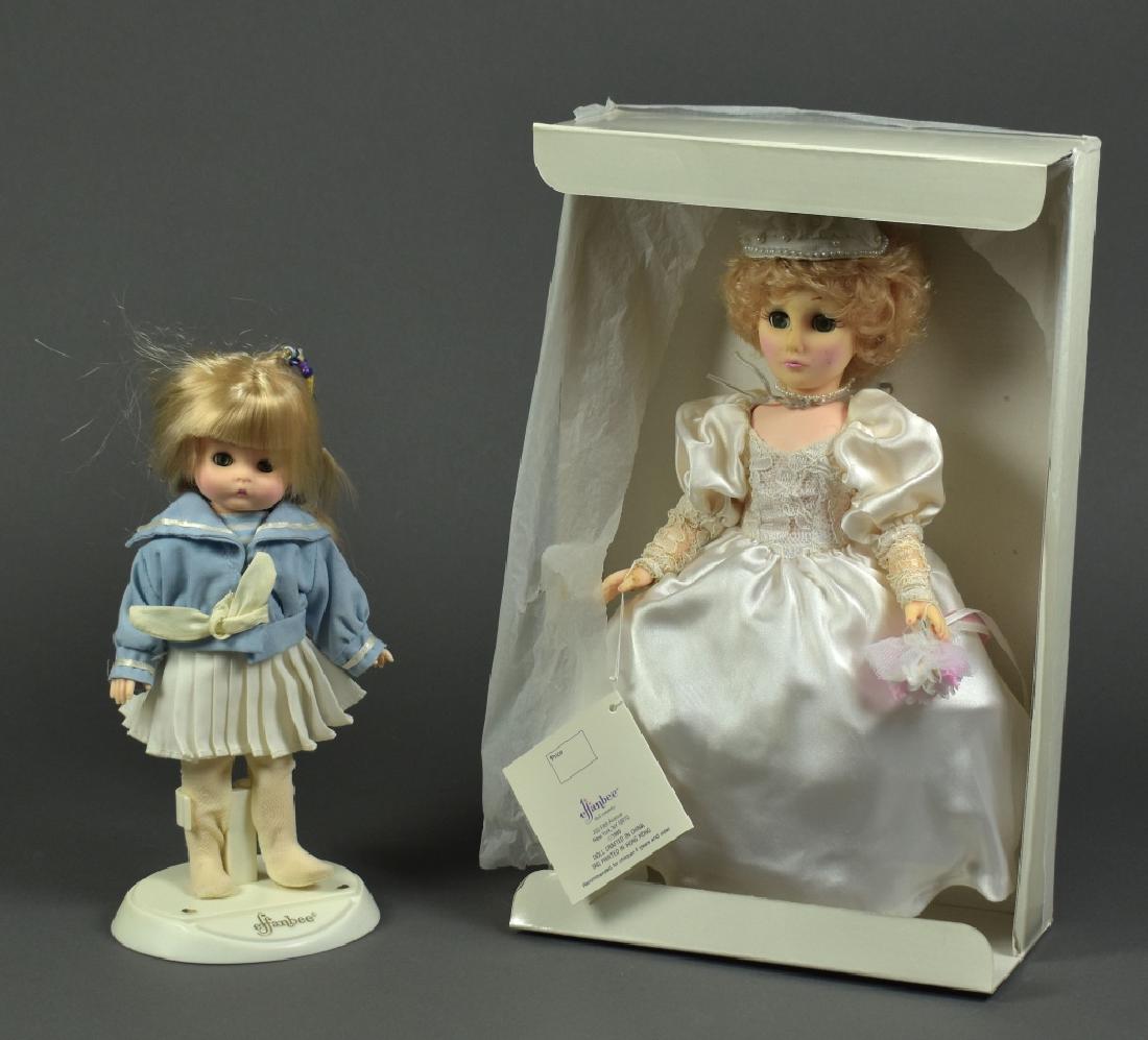 Two Effanbee Dolls: 11" Bride from the Joyous Occasion Series, still in the box. Vinyl face shows splotching. Along with girl in sailor suit, hair is mussed.