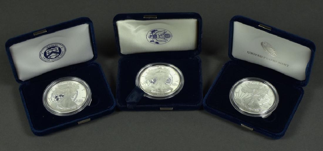 Three Proof Silver Eagles Dates are 2004, 2011 and (1 of 4)