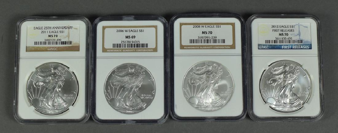 Four Silver Eagles All certified by NGC.  Dates are (1 of 2)