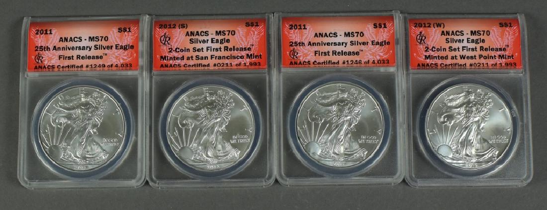 Four Silver Eagles Two 2001 silver eagles graded  MS 70 (1 of 2)