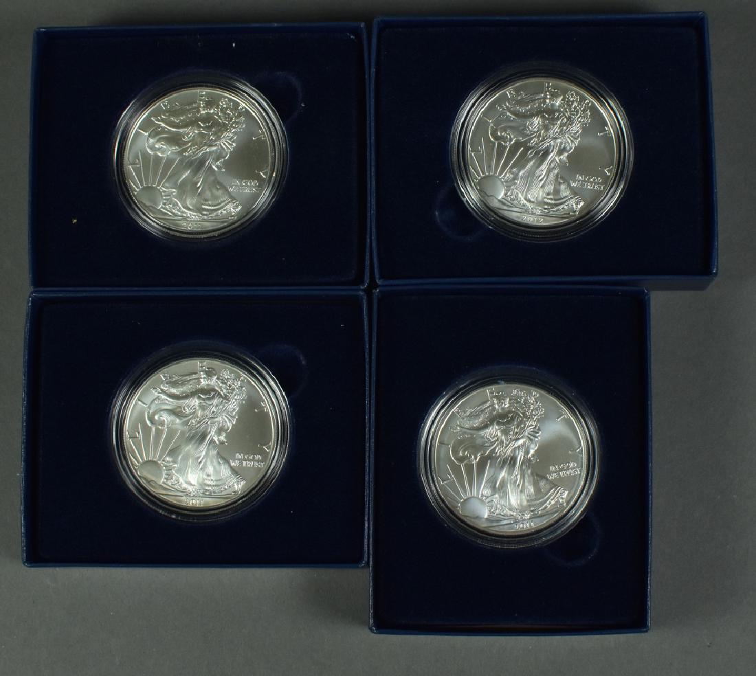 Four Silver Uncirculated Eagles In mint issued boxes; (1 of 2)