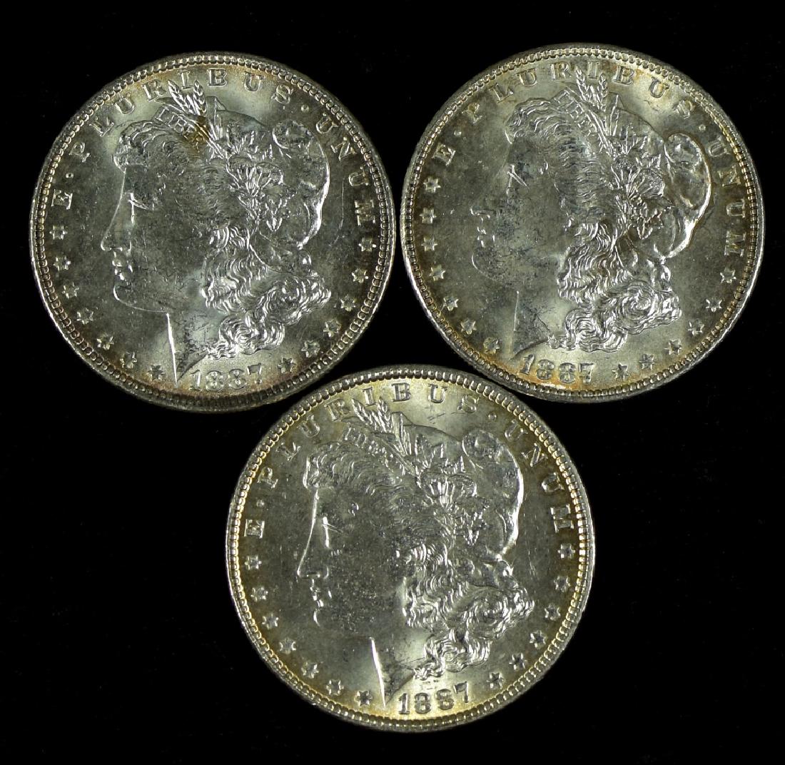 Three 1887 Morgan Dollars Choice uncirculated. MS62-63. (1 of 2)