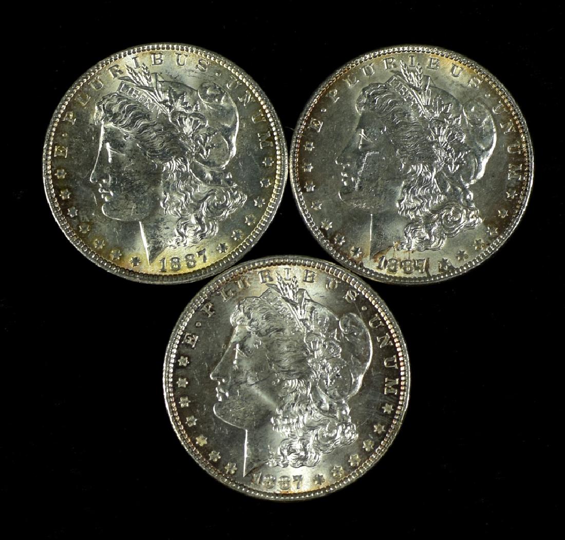 Three 1887 Morgan Dollars Choice uncirculated. MS62-63. (1 of 2)