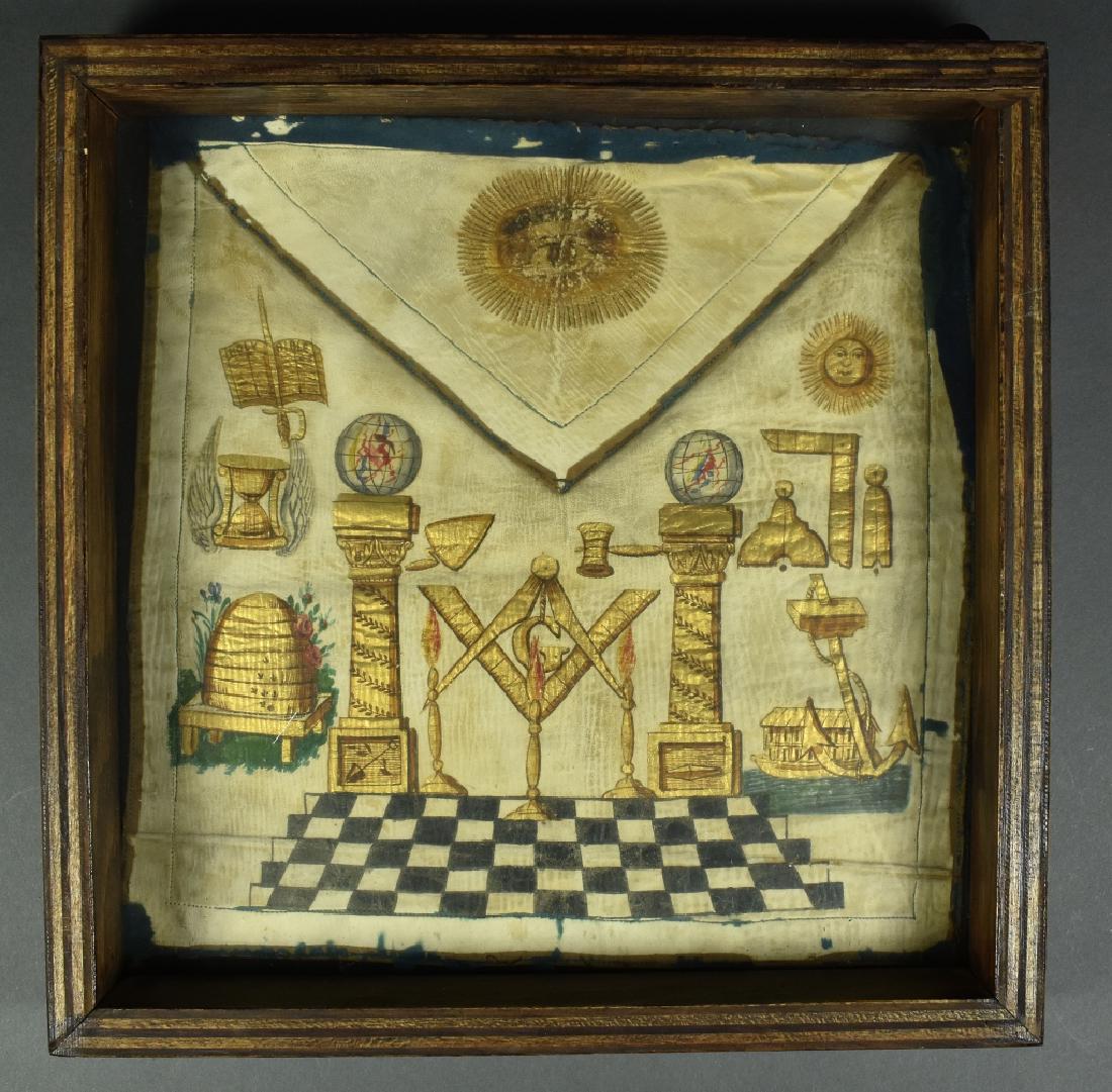 19th Century Painted Masonic Apron 19th Century leather: 19th Century leather Masonic apron with great gilt painting of beehive, Masonic tools, globes, etc. Unnamed. Loss of cloth border around the edges but only minor loss of the paint mostly from the Eye