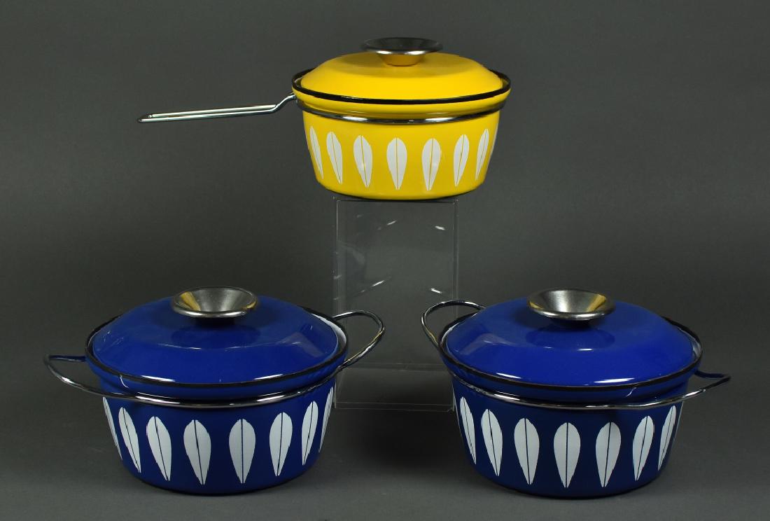 Catherineholm Norway MCM Enamel Cookware Includes a: Includes a yellow saucepan and two blue lidded bowls in Lotus pattern. Good condition with some interior wear. Blue bowl has an 8" diameter.