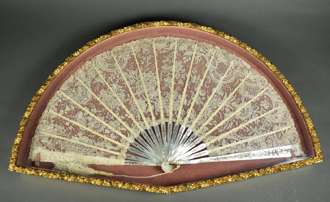 Framed Very Large Mother of Pearl and Lace Fan Very: Very good condition and nicely housed in a shadow box frame. 29"L x 17"W x 2"D.