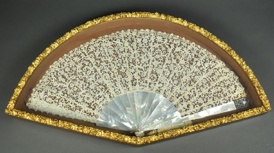 Framed Large Mother of Pearl and Lace Fan Very good: Very good condition and nicely housed in a shadow box frame. 25"L x 13 1/2"W x 2"D.