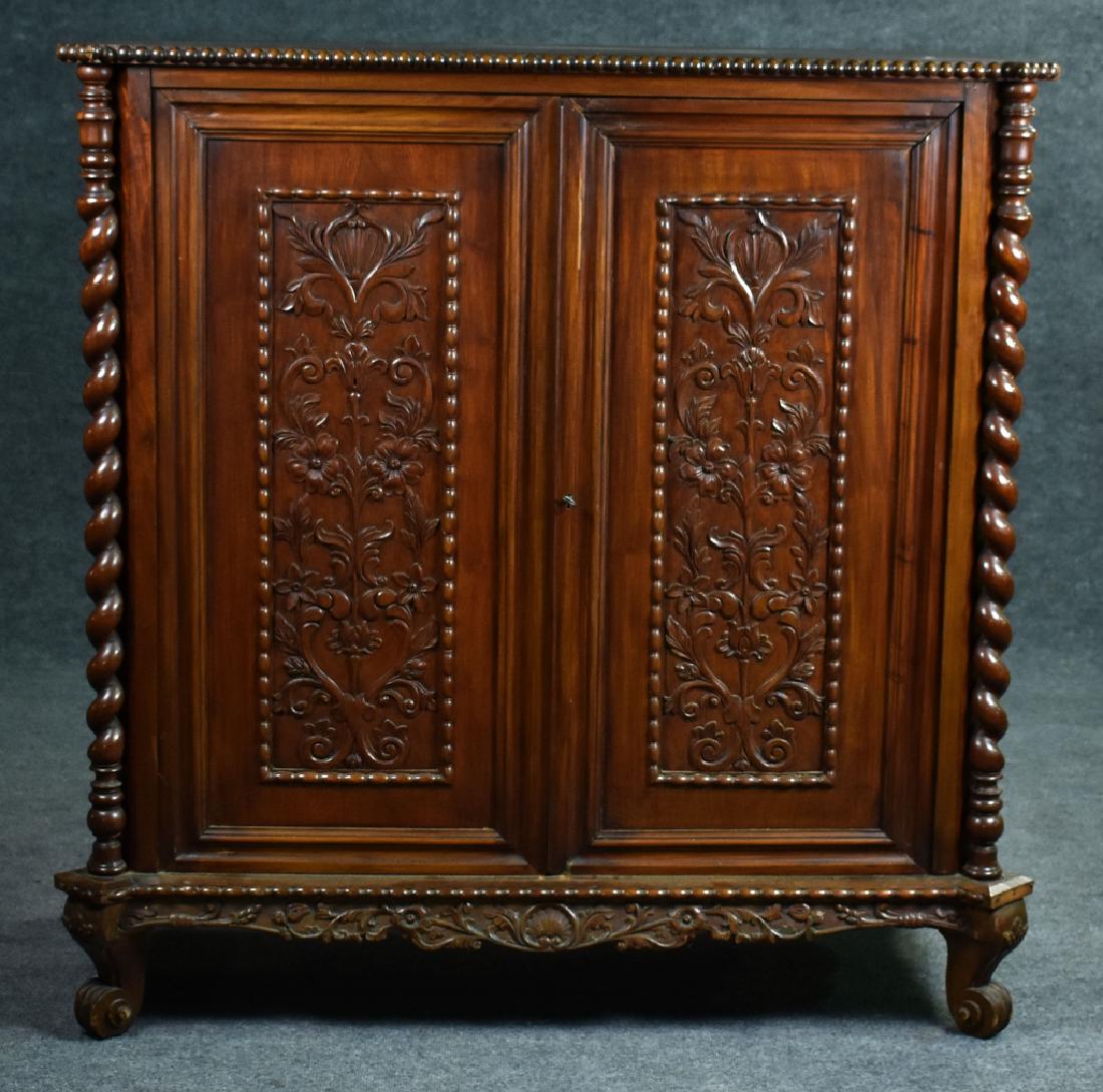 Carved Mahogany Chest Having two carved paneled doors,: Having two carved paneled doors, concealing four over three dressing slides. Circa 1900. 47" x 45" x 21".