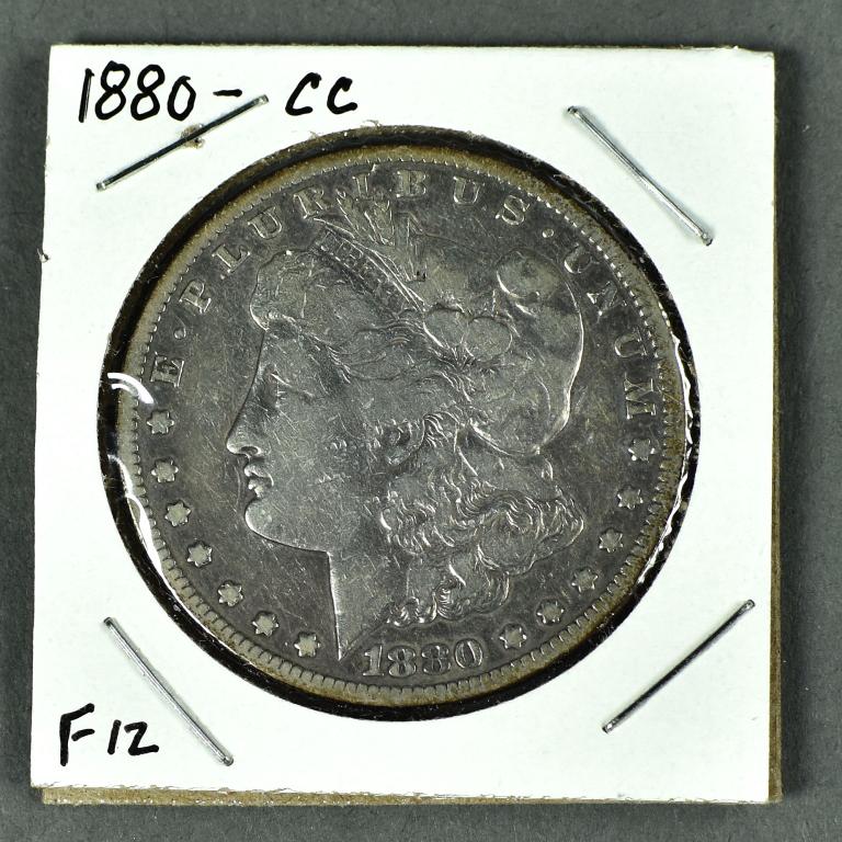 Scarce 1880-CC Morgan Dollar: Grades F12 with a few small gorges on reverse. Not a bad looking coin.
