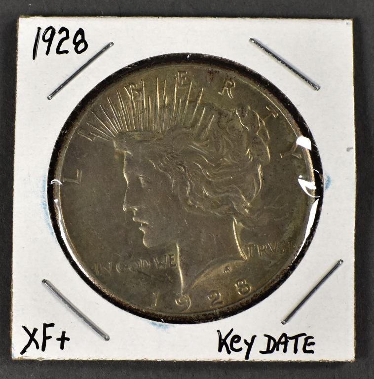 1928 Peace Dollar: Key coin in the series. Grades nice (XF+, very close to AU). Nice coin for the collector.