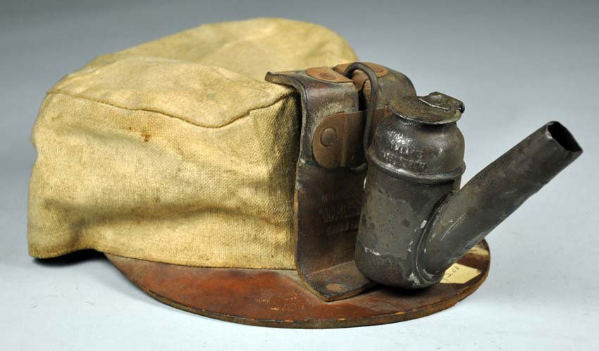 Early Soft Type Miner's Cap with Teapot Lamp: Early Soft Type Miner's Cap with Teapot Lamp Hat is soiled and leather is solid. Lamp shows rust and is missing wick. 4"" x 12"" x 7"".
