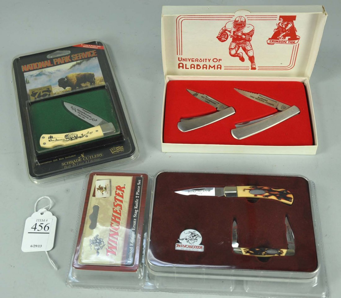 Five Folding Knives: Two knife set from Cherokee Cutlery "University of Alabama 1992 Ntional (Football) Champions" in original box; both numbered 477. Schrade Cutlery scrimshaw single-blade commemorating the 75th annivers