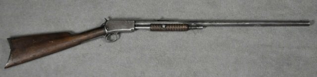 Winchester Model 1890 .22 Long Only Rifle: Ser# 592373A. All grey gun with many repairs. Trigger guard has different ser#. Slide repaired and renewed. Magazine cut down. Bore is heavily pitted. Stocks moderate use. Barrel 24". *Registration Re