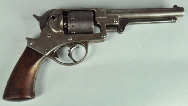 Model 1858 Starr Army Revolver: All grey gun missing retaining screw. Ser# 17068. Grips have inspector cartouche. Needs tuning, will not cycle correctly. Cylinder is non matching. Barrel, 6" overall, 11 1/2".