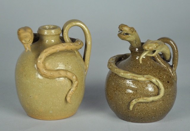 Two North Carolina North Cole Snake Jugs: Larger with single snake, 4" H. Signed on base, "North Cole Pottery/1992/Sanford, NC/Sandy Cole/KS Brown." Smaller, with full snake and head of snake peeking out of jug spout, 4" H. Signed on base, "N