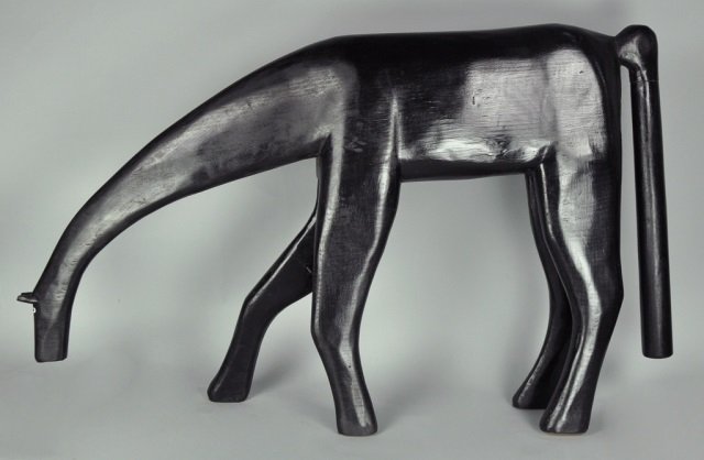 Minnie Adkins Carved & Painted Horse: American - Kentucky, b. 1934. Black horse signed, "G&M Adkins" for Garland and Minnie Adkins. Also marked, "1990 ©." 19 1/2 x 32 1/2. Adkins is recognized as the leader of Kentucky folk art. From the
