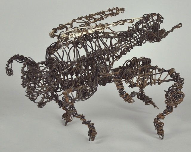 Folk Art "Skeeter" by Columus McGriff: American - Georgia. Circa 1990. Done from twisted wire coat hangers. This folk art construction by McGriff has movable wings and rear legs. Good condition. Along with photo of artist with the piece. F