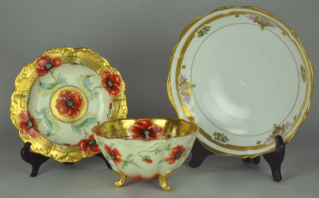 Two Pieces Handpainted Limoges Pickard Poppy China: Including tri-footed bowl with gilt inner border and decorative rust colored poppies throughout, no mark on base, 3 1/2" H. x 6 3/4" Dia.; and low dish in matching pattern, marked on reverse in green,