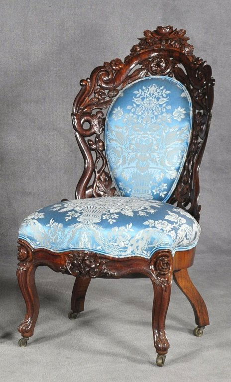 John Henry Belter Parlor Chair: Mid 19th century, Victorian Rococo Revival style. Carved and laminated rosewood. “Fountain Elms” pattern having oak leaves and acorns. Pale blue damask upholstery, cabriole legs, casters, 36" H. A