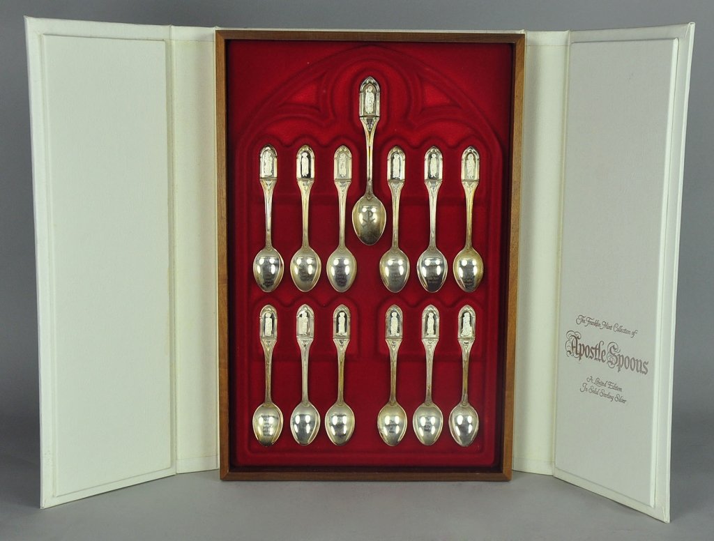 Sterling Silver Apostle Spoons: By Franklin Mint, in fitted box. Set of 13. Each with symbol of the apostles martyrdom and with etched segments from the apostles creed. The thirteenth spoon being a figure of Christ with Chi Ro cross