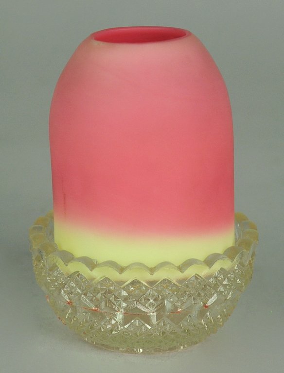 Burmese Fairy Lamp by Thomas Webb & Sons: Produced in England, 1885-1925. Clear glass base insert marked, "S. Clarke Fairy Pyramid." 4" H. x 2 3/4" W.