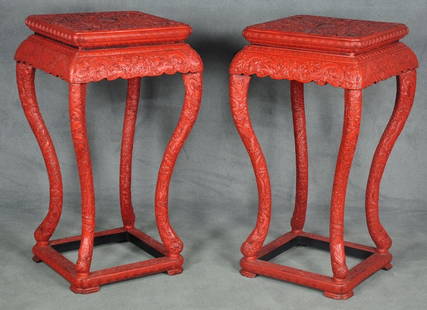 Pair of Chinese Carved Cinnabar Pedestals: Each highly carved with tops having central dragon motif - decorated with carved dragon and cloud motif throughout. In cinnabar red. Having cabriole legs and box stretcher. With label reading "Antique