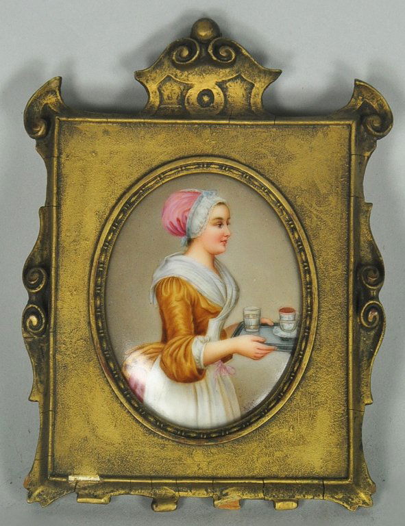 Miniature Oil on Porcelain: Nicely painted scene of maid carrying tray with glass of water and a mug. Oval, 3 1/8" x 2 3/8" s.s., in gilded frame to 6" x 4 1/2".