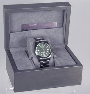 Bamford Enhanced Men's Rolex Watch: All black watch with green tinted glass and green "lightning bolt" seconds hand. Face reads "Rolex/Oyster Perpetual/Milgauss/Bamford/Superlative Chronometer/Officially Certified/Swiss Made." With Bamf