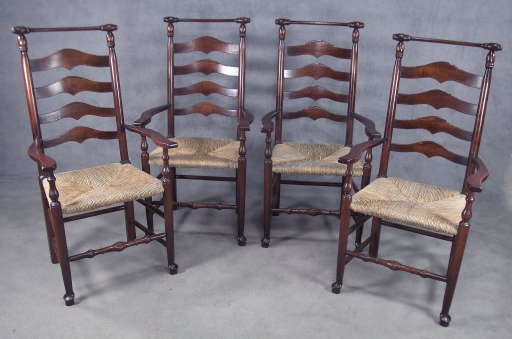 Set of Four Ladder-Back Arm Chairs: Late 20th century. Country French style. With woven rush seats. 44" H.