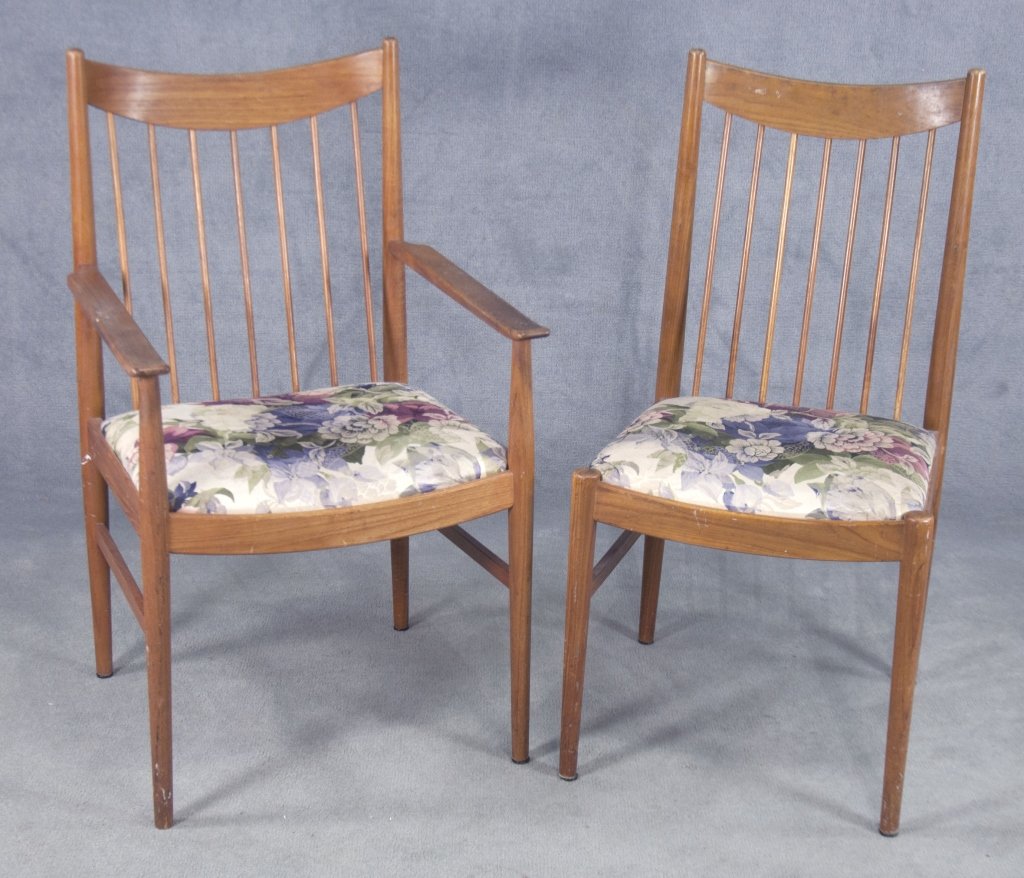 Pair Arne Vodder Danish Modern Chairs: Danish, 1926-2009. Mid 20th century. With stickers reading "Sibast Furniture/Denmark" and "Made in Denmark." With slanted spindle back and tapered legs. Includes one arm chair and one side chair. Both
