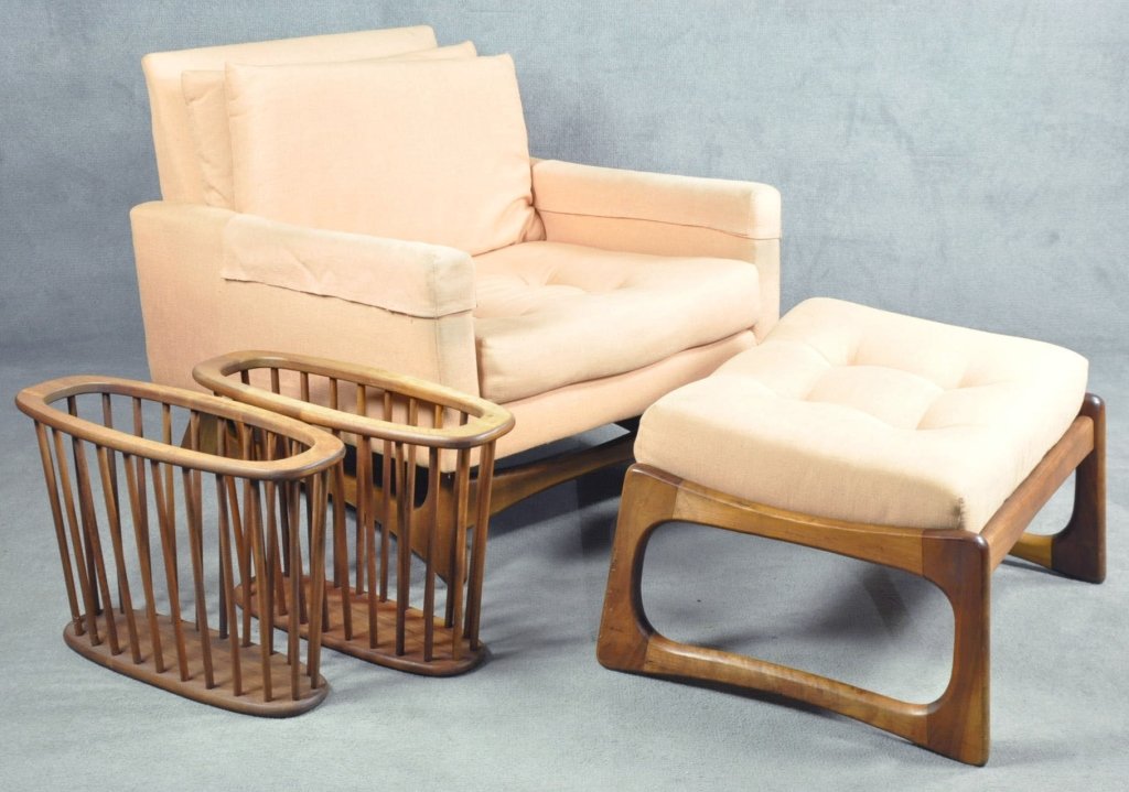Adrian Pearsall Lounge Chair: American, 1925-2011. Mid 20th century, for Craft Associates. Walnut. With ottoman. Both with replaced upholstery (with wear). 28 1/4" x 34". Along with pair of wooden magazine holders.