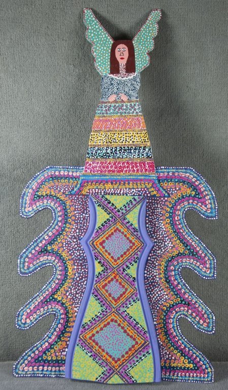 James Harold Jennings Angel: American - Pinnacle, N.C., 1931-1999. Carved and painted wood and paint on board. Depicts angel with green wings and colorful dress atop vibrant "winged" base. Signed in red marker on reverse, "James