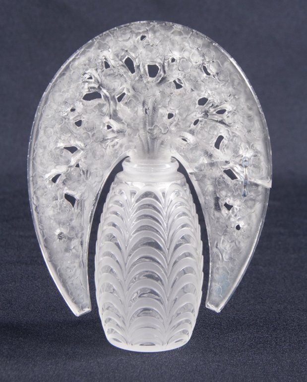 Lalique "Bouchon Fleurs de Pommier" Perfume Bottle: Designed by Rene Lalique in 1919. With apple blossom stopper. Frosted underside. Engraved signature on stopper reads, "R. Lalique France" in cursive. Having staple repair to stopper and substantial ch