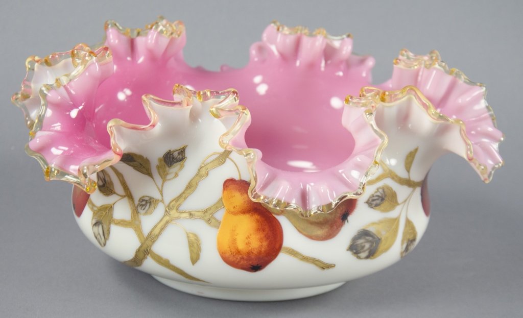 Decorated English Bride's Basket or Fruit Bowl: By Thomas Webb & Sons. Decorated with raised enameled pears and gilt leaves and stems. Pink interior with amber ruffled rim. Produced near Stourbridge, England, 1804-1869. Firing flaw on rim. 5 3/4" x