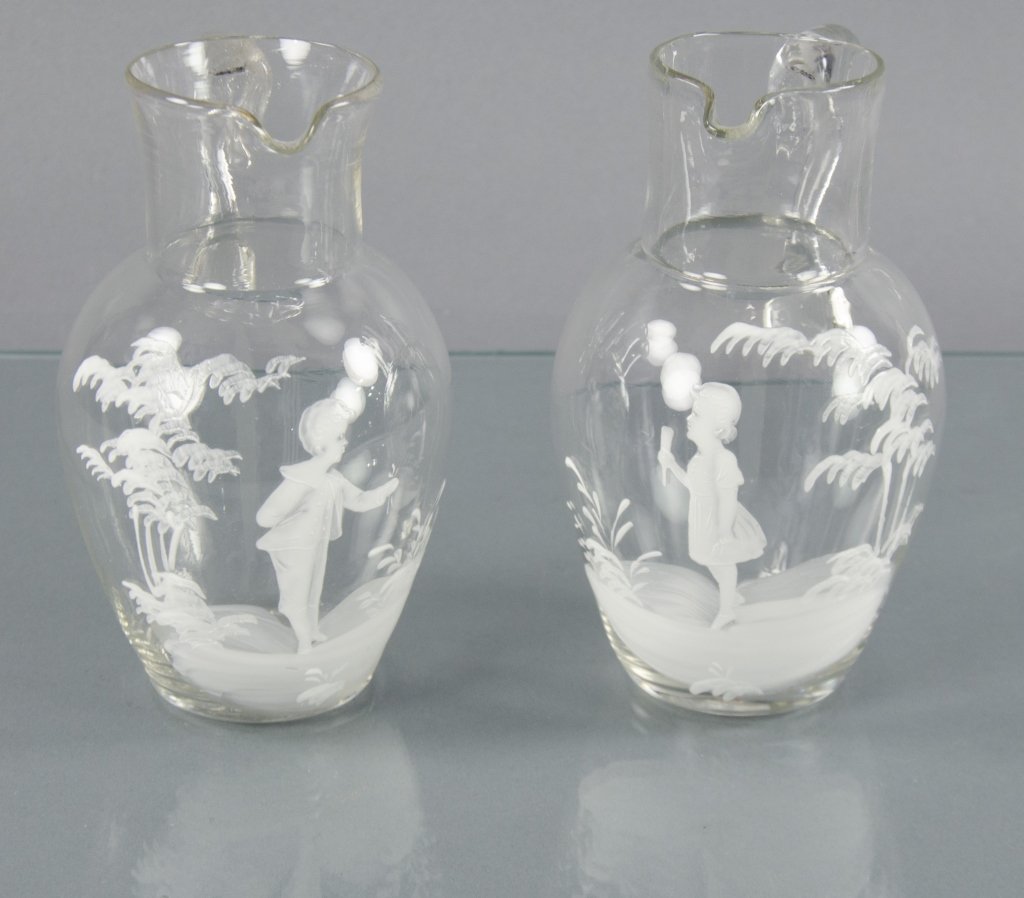 Two Clear Glass Mary Gregory Pitchers (1 of 2)