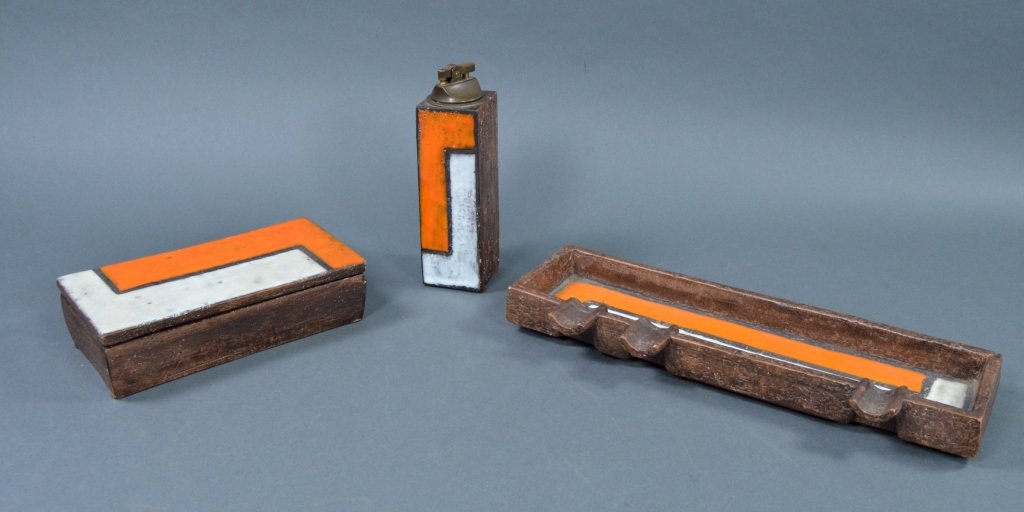 Mid-Century Italian Raymor Ceramic Smoking Set: Likely designed by Aldo Londi. All three pieces rectangular with rough textured brown surface, overlaid with milky white and burnt orange glaze in geometric pattern. Includes cigarette box, 2" x 4" x